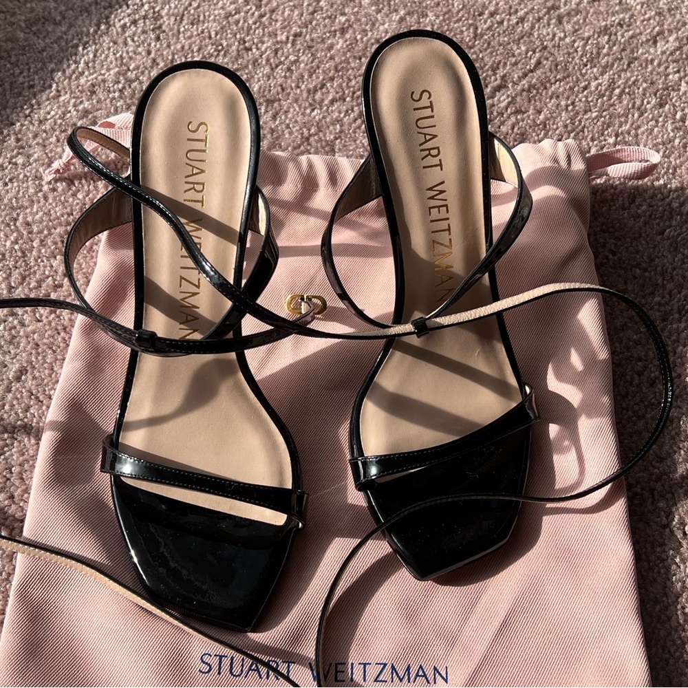 Brand new Never Worn Stuart Weitzman
Ellsie Ankle-Wrap Patent Leather Sandals